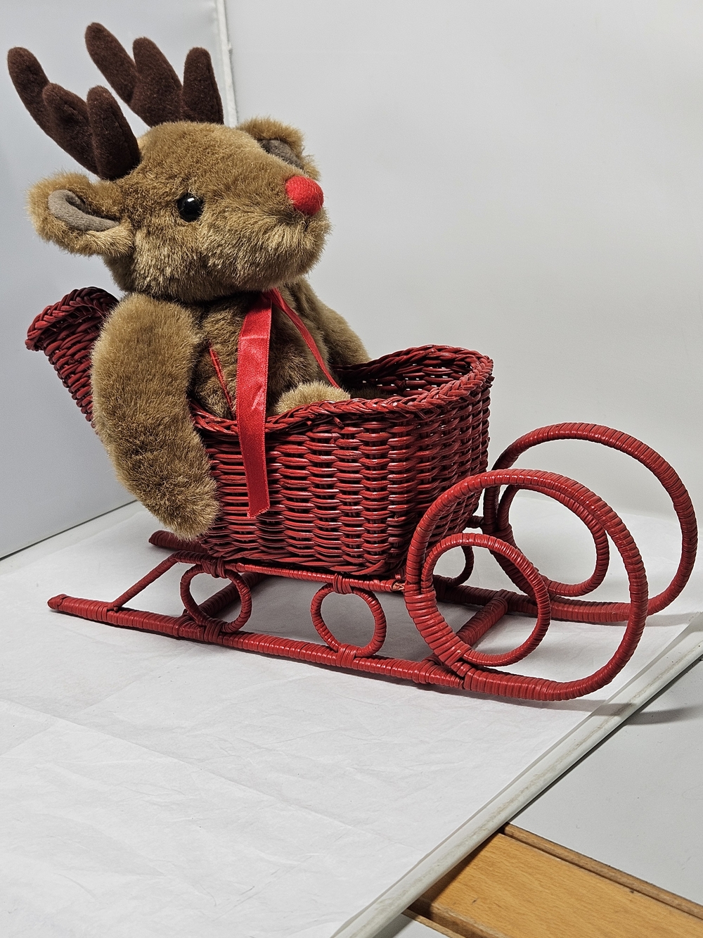 Plush Reindeer in Red Wicker Sleigh Christmas Holiday Decor